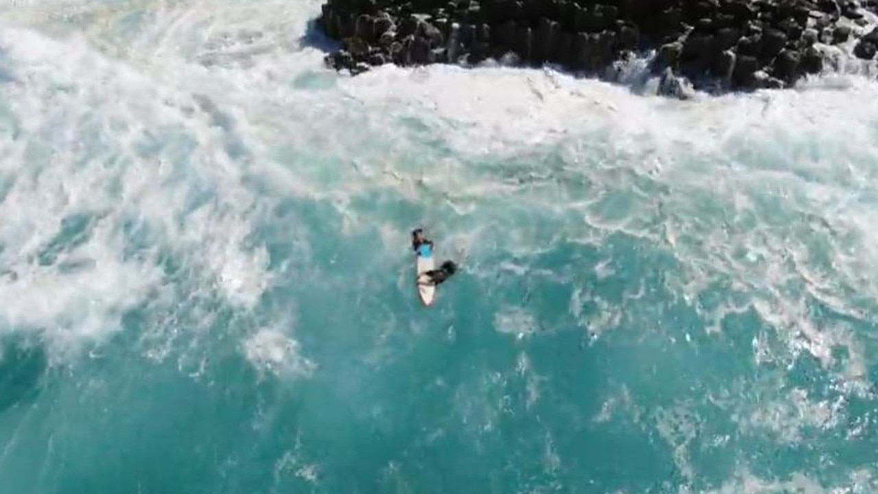 The wild rescue was caught on drone video. Vision: Surf Life Saving NSW / Australian UAV Service