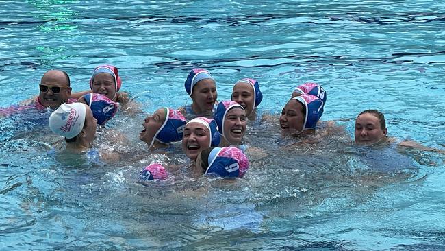 The Mermaids celebrate their 18As win.