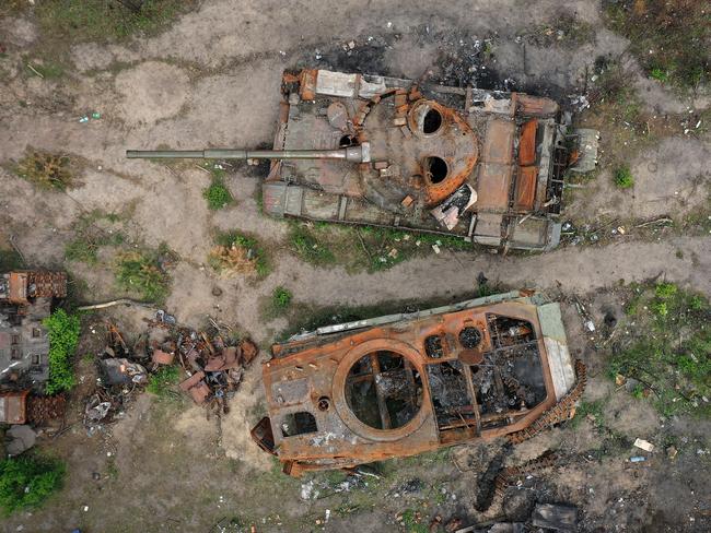 Destroyed Russian battle tanks and armoured vehicles lay beside a road in Irpin, Ukraine. Picture: Getty Images