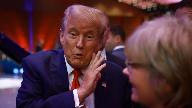 Donald Trump greets supporters as he leaves the ‘town hall’ TV event in Des Moines, Iowa. Picture: AFP