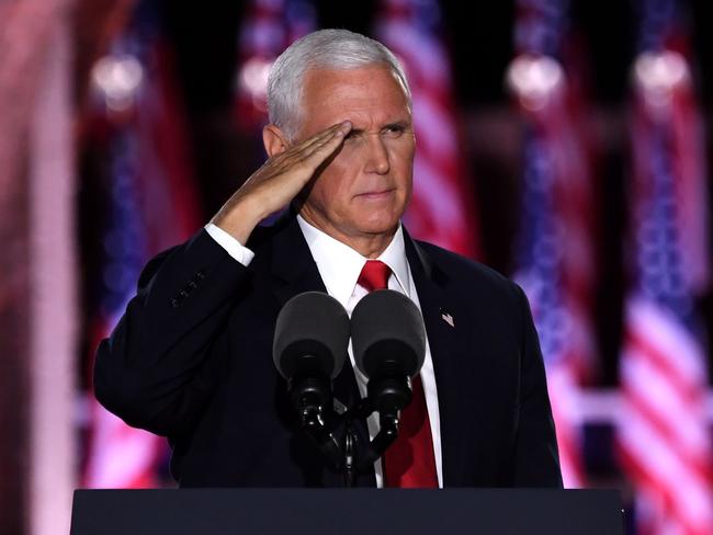 US Vice President Mike Pence salutes after speaking during the third night of the Republican National Convention at Fort McHenry National Monument in Baltimore, Maryland, August 26, 2020. (Photo by SAUL LOEB / AFP)