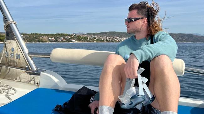 Jack Sinclair relaxing on the water in Croatia, that famed mullet just relishing the sea breeze.