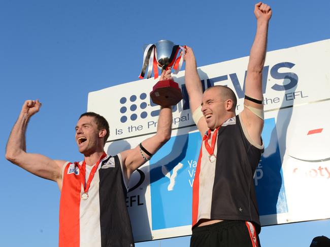 Brett Moyle celebrates the 2012 grand final win with captain Nick Harbeck.