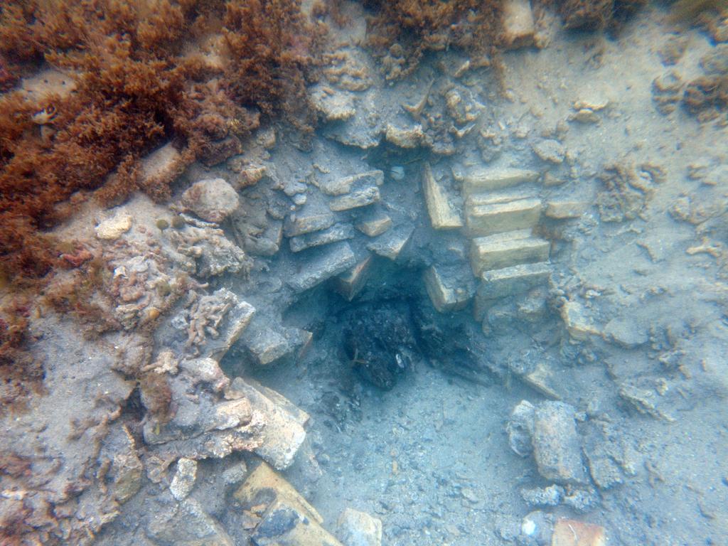 KIDS NEWS. Excavated hole with visible bricks and wood from the shipwreck. Photo: John FhÃ¦r Engedal Nissen, the National Museum of Denmark