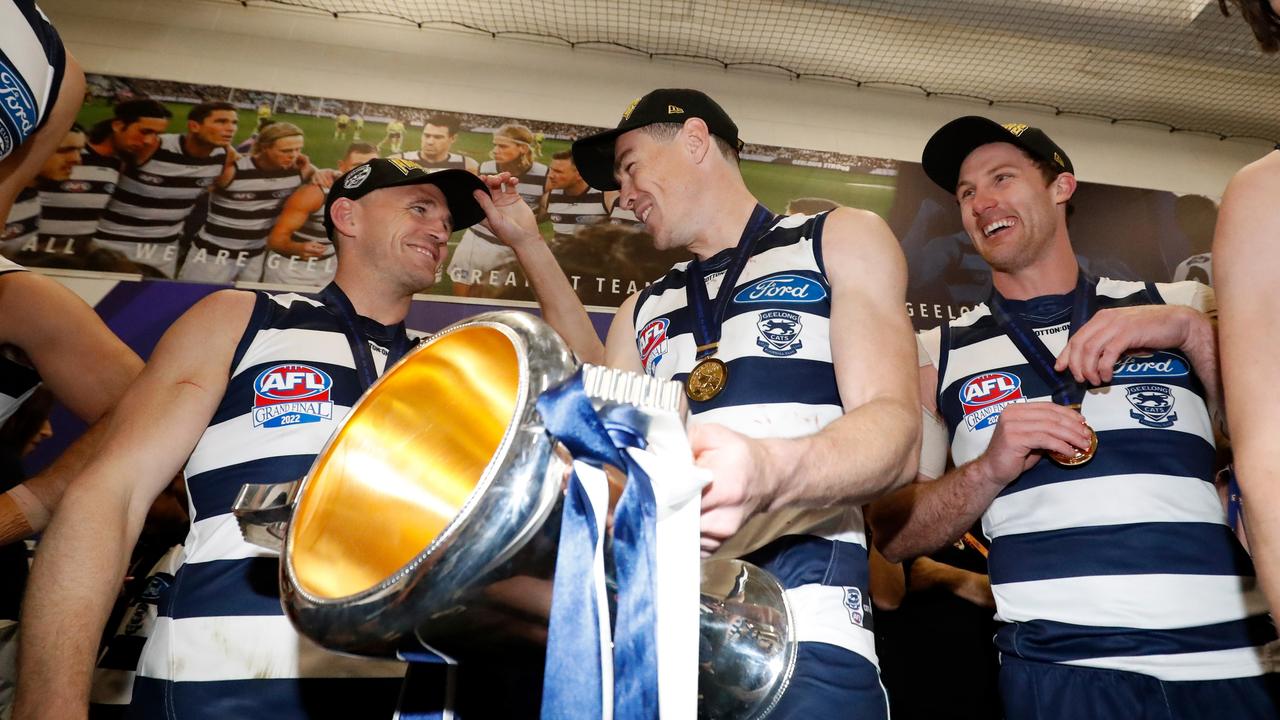 Selwood, Cameron and Jed Bews with the premiership cup after the match. Picture: AFL Photos/Getty Images