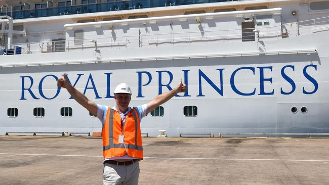 Tourism and Hospitality Minister Joel Bowden in front of the Royal Princess cruise ship.