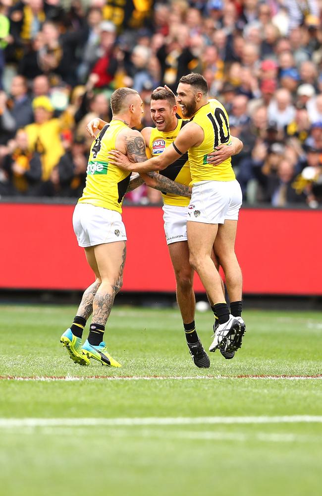 Dustin Martin and Shane Edwards celebrate with Jack Graham after he kicked a goal during the 2017 AFL Grand Final against Adelaide. Picture: Mark Kolbe/AFL Media/Getty Images.