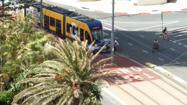 The scene on Surfers Paradise Boulevard after the car collided with the tram.