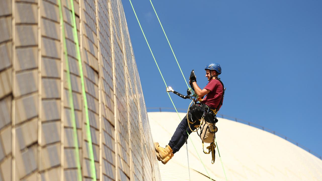 Building Operations staff inspect tiles on the Sydney Opera House sails in 2022. Picture: Mark Metcalfe/Getty Images