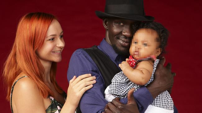 Former Australian of the Year and child soldier Deng Adut with Tamryn Beveridge and their daughter Athieu. Picture: Justin Lloyd