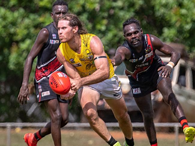 Brodie Filo of Nightcliff takes on Tiwi Bombers. Picture: Warren Leyden / AFLNT Media