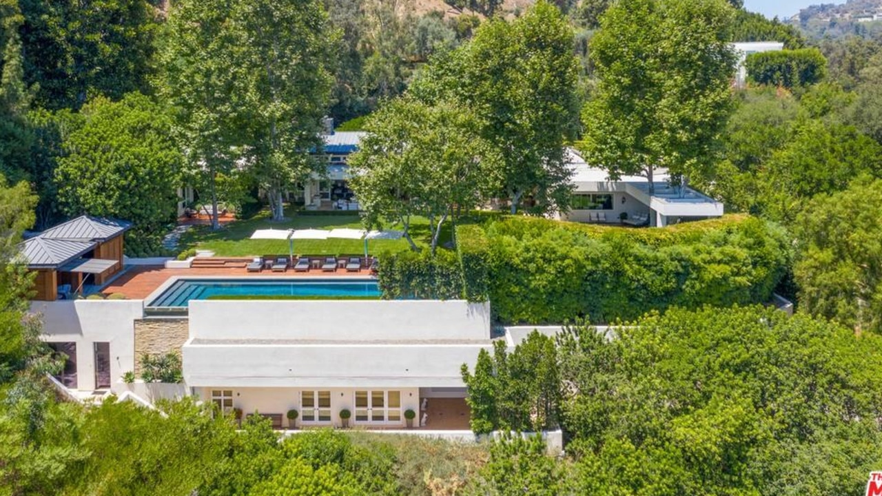 The home is well hidden among the hills, and boasts ocean views. Picture: Realtor