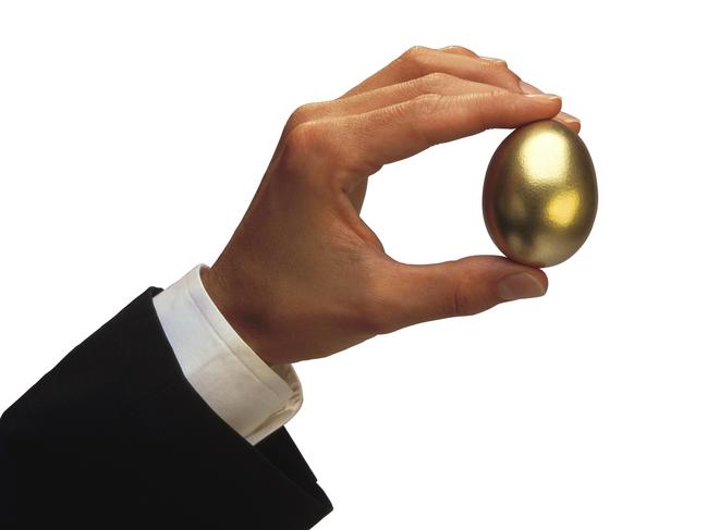 Man holding golden egg. Superannuation. Generic image.