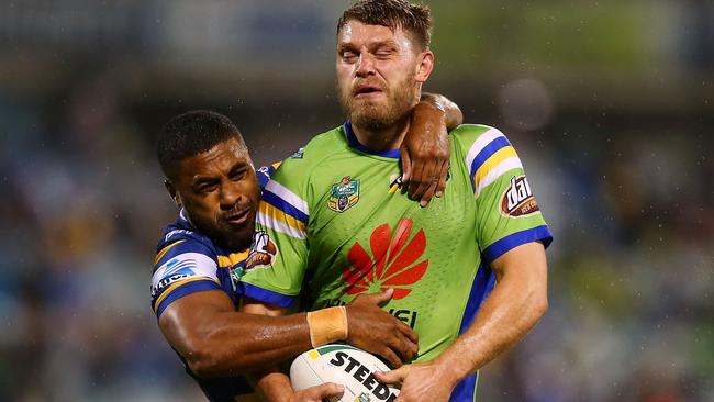 Raiders forward Elliot Whitehead takes on the Eels defence.