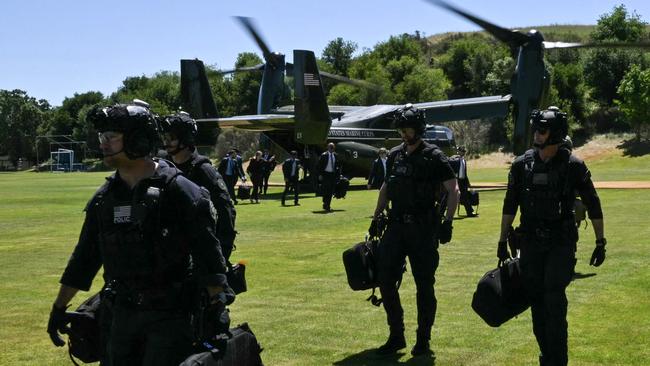 A US Secret Service counter-assault team arrives ahead of Joe Biden at a landing zone in California in May. Picture: AFP