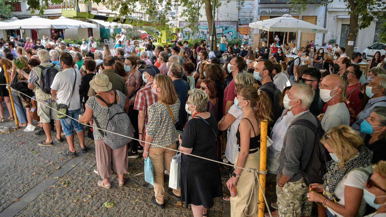 People queue to pay respect to the late Greek composer Mikis Theodorakis at the Athens Metropolitan Cathedral on September 6. His body lay in state for 2 days. Picture: Louisa Gouliamaki/ AFP