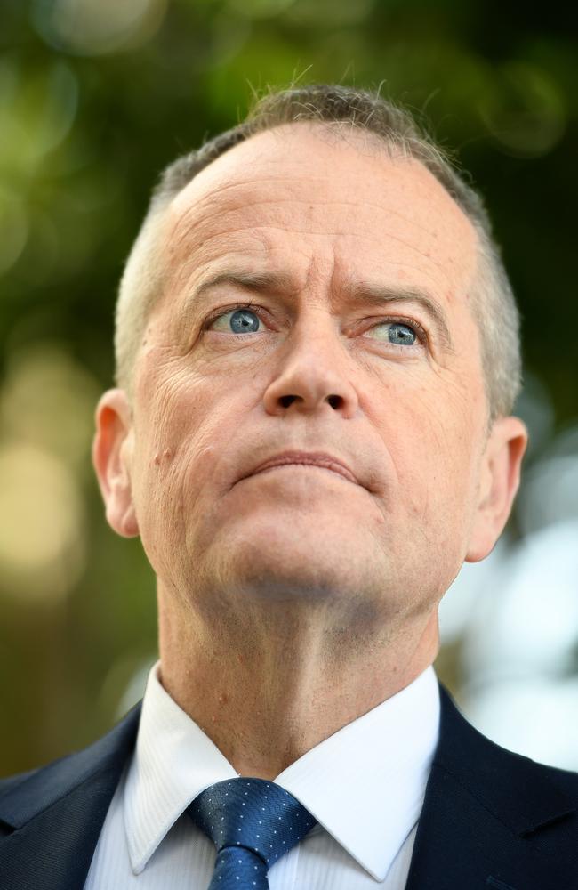 An ashen-faced Mr Shorten emerged from a hastily arranged meeting with senior colleagues to announce he was walking away from his week-long pledge to repeal the Turnbull Government’s company tax cuts. Picture: AAP