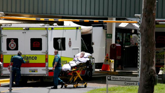 An elderly lady is taken into QEII Hospital at Mt Gravatt on Wednesday. Picture: David Clark