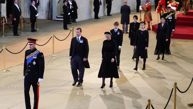 Prince William leads the grandchildren after the vigil, with Prince Harry following at the rear. Picture: AFP