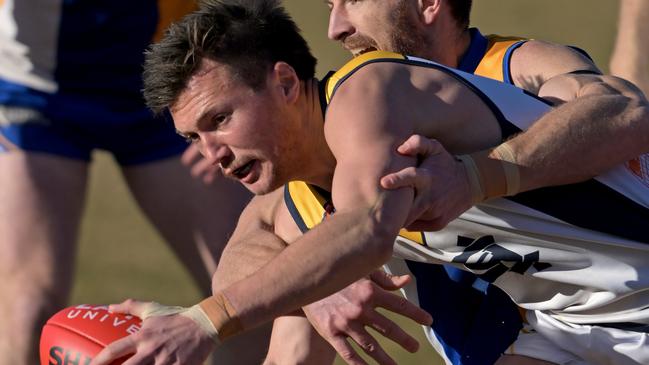 Blake Fitzgerald wins for the ball for Hurstbridge. Picture: Andy Brownbill