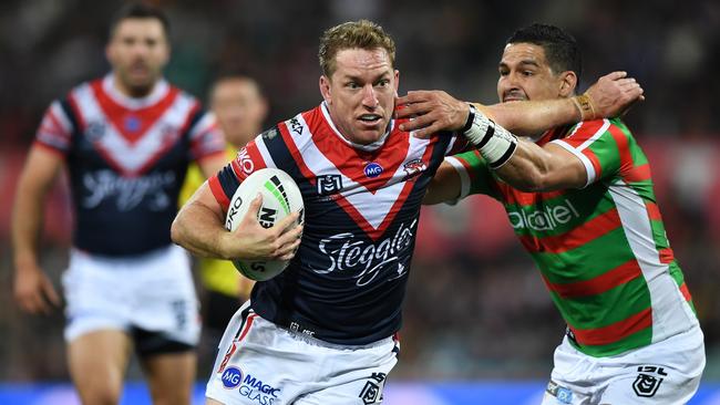 Roosters second-rower Mitchell Aubusson fends off South Sydney's Cody Walker in an NRL game last season. Both are Northern Rivers products. Photo Joel Carrett