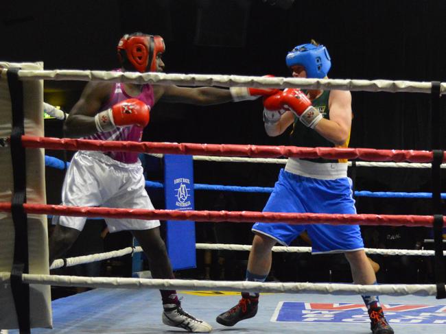 Greg Toby (left) on his way to the gold medal in the 78kg division.