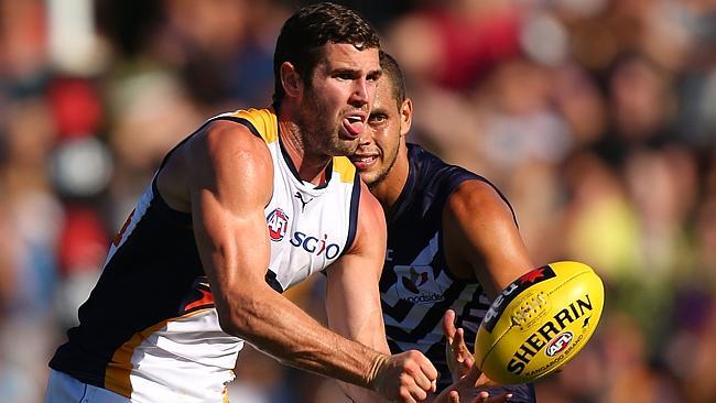 Jack Darling fires off a handball in the NAB Challenge match against Fremantle.