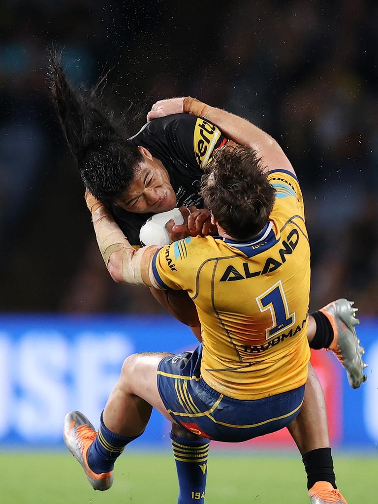 Brian To'o of the Panthers is tackled by Clinton Gutherson of the Eels during the 2022 NRL Grand Final match between the Penrith Panthers and the Parramatta Eels at Accor Stadium on October 02, 2022, in Sydney, Australia.