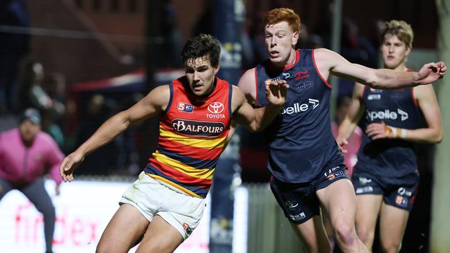 Louis Sharrad from the Crows and Tom Donnelly from Norwood. Picture: David Mariuz