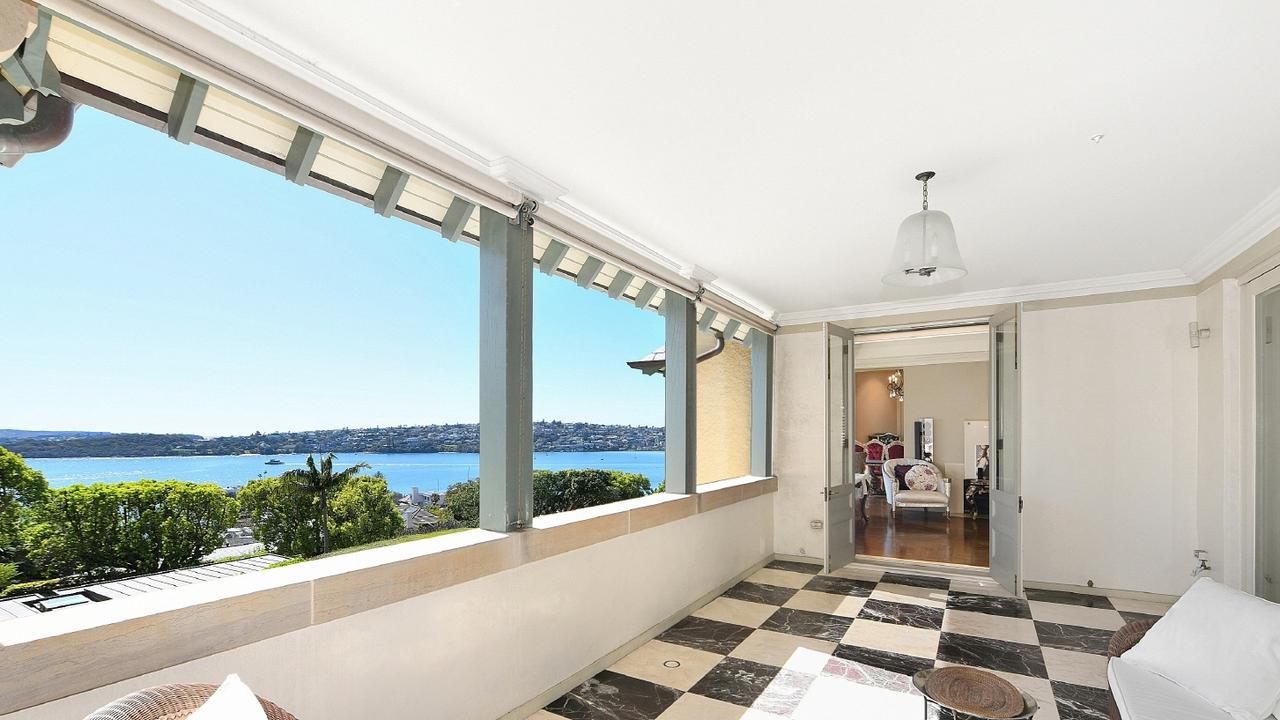 A loggia-style covered terrace with marble floors is big enough for all weather dining.