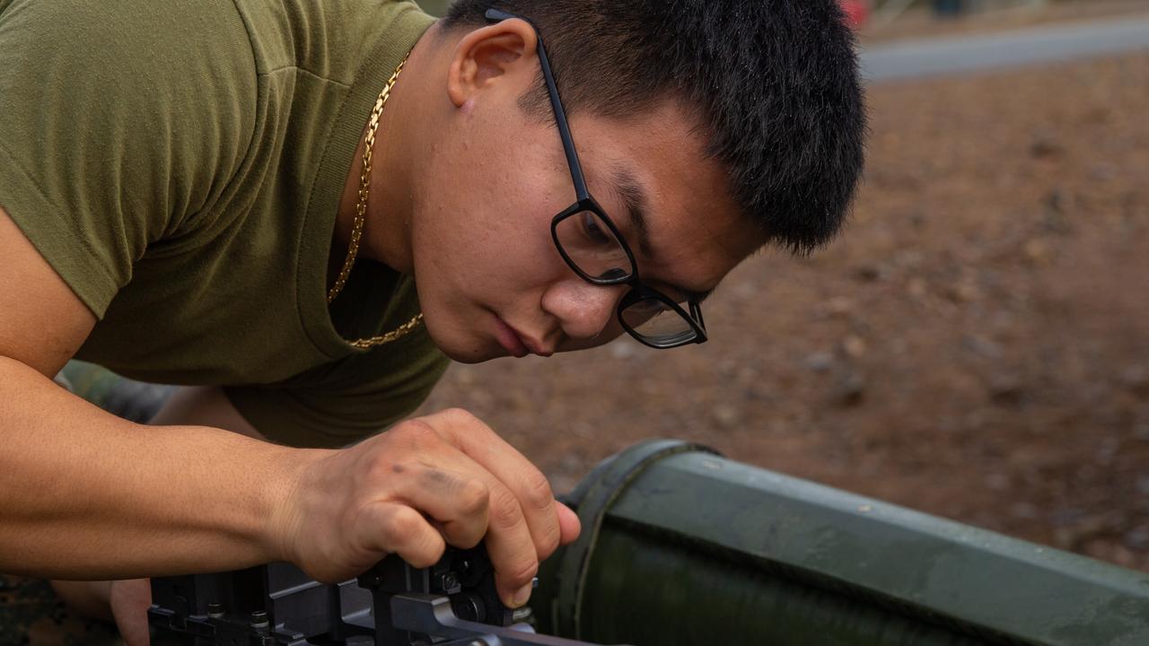 U.S. Marine Corps Lance Cpl. Guoyao Ma, a field artillery cannoneer with 3d Battalion, 12th Marines, 3d Marine Division, reassembles the breach of an M777A2 155mm Howitzer during Exercise Talisman Sabre 2021 on Shoalwater Bay Training Area in Queensland, Australia, July 14, 2021. TS21 is a large-scale, bilateral military exercise conducted biennially across Northern Australia designed to enhance the U.S.-Australia alliance which is an anchor of peace and stability in the Indo-Pacific. Exercises like this provide effective and intense training to ensure our forces are capable, interoperable, responsive, and combat-ready. Ma is a native of Houston, Texas. (U.S. Marine Corps photo by Lance Cpl. Ujian Gosun)