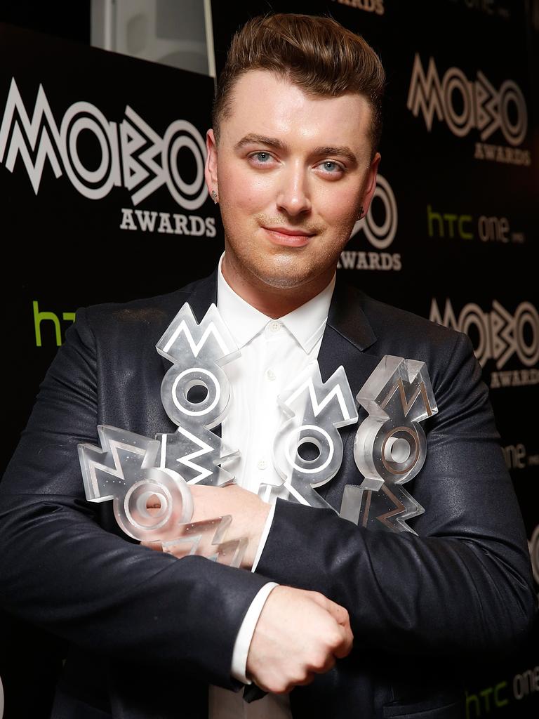 Sam Smith poses with his awards for Best R&amp;B and Soul, Best Song, Best Album and Best Male Act in the winners room at the MOBO Awards in London, England. Picture: Getty