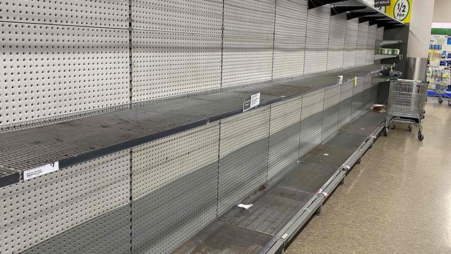 Shelves usually stocked with toilet rolls are empty in supermarkets across Australia amid panic buying. Picture: Saeed Khan/AFP