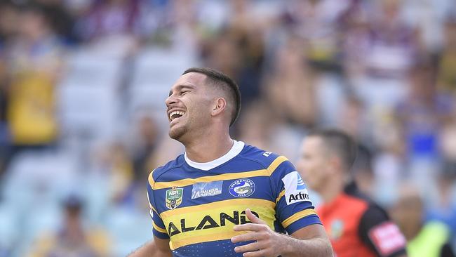 SYDNEY, AUSTRALIA — APRIL 22: Corey Norman of the Eels celebrates scoring a try during the round seven NRL match between the Parramatta Eels and the Manly Sea Eagles at ANZ Stadium on April 22, 2018 in Sydney, Australia. (Photo by Brett Hemmings/Getty Images)