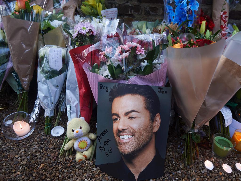 Flowers, candles and messages left by fans in tribute outside the home of George Michael following his death in 2016. Picture: AFP