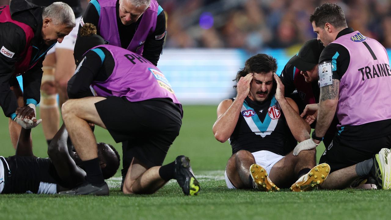 Aliir Aliir of the Power down along with Lachie Jones of the Power. Picture: Sarah Reed/AFL Photos via Getty Images