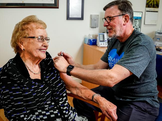 Dr Daniel Byrne gives one of Australia’s first AstraZeneca vaccines to 98-year-old Evelyn Jones. Picture: Mike Burton