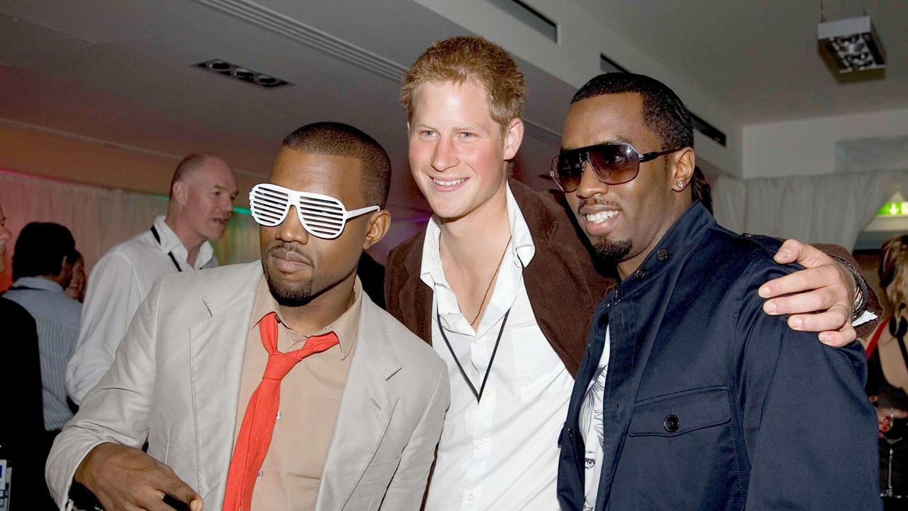 Diddy and West posing for a photograph with Prince Harry at Wembley Stadium. Picture:Corbis via Getty Images.