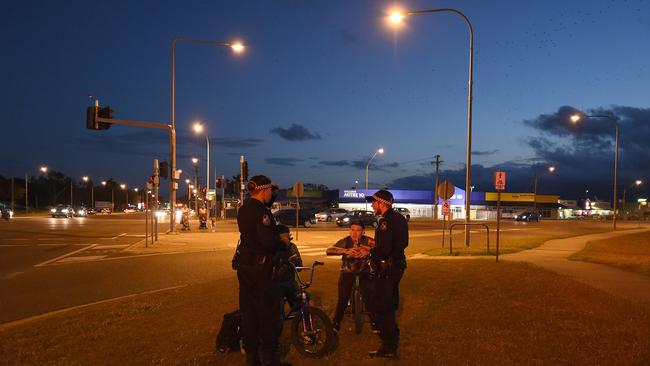 Mount Isa Tactical Crime Squad members in Townsville doing street checks on people in Townsville. Picture: Zak Simmonds