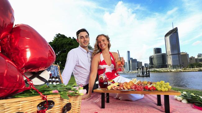 Jack Law and Sophie Radunz snuggle up for Valentines Day on the Green at Southbank. Pics Adam Head