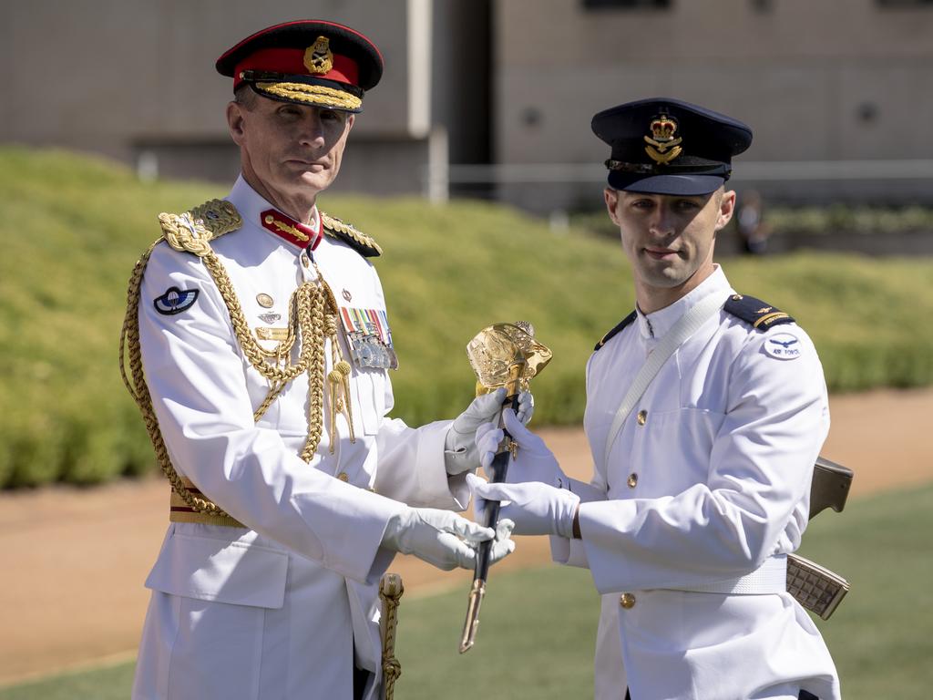 Chief of Defence Force General Angus Campbell presents the CDF Sword of Honour for Leadership to Officer Cadet Tavis Ellis-Southwell during the 2020 ADFA Graduation Parade in Canberra. Picture: Defence