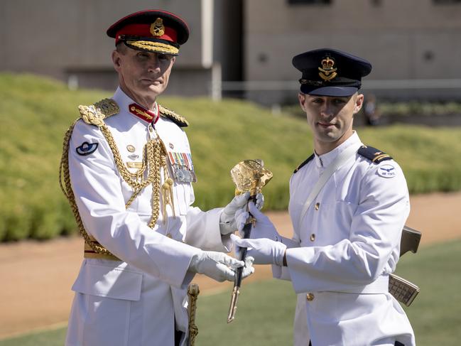 Chief of Defence Force General Angus Campbell presents the CDF Sword of Honour for Leadership to Officer Cadet Tavis Ellis-Southwell during the 2020 ADFA Graduation Parade in Canberra. Picture: Defence