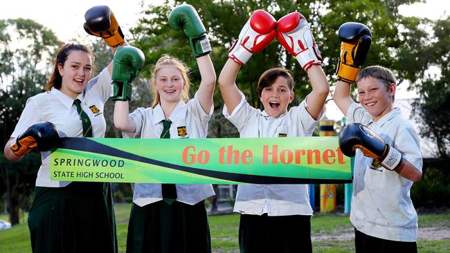 Springwood State High School students Lily Ryan, Liberty Procopis, Kaleb Stehr, and Thor Waters regularly have boxing sessions with Jeff Horn. Picture: Peter Cronin