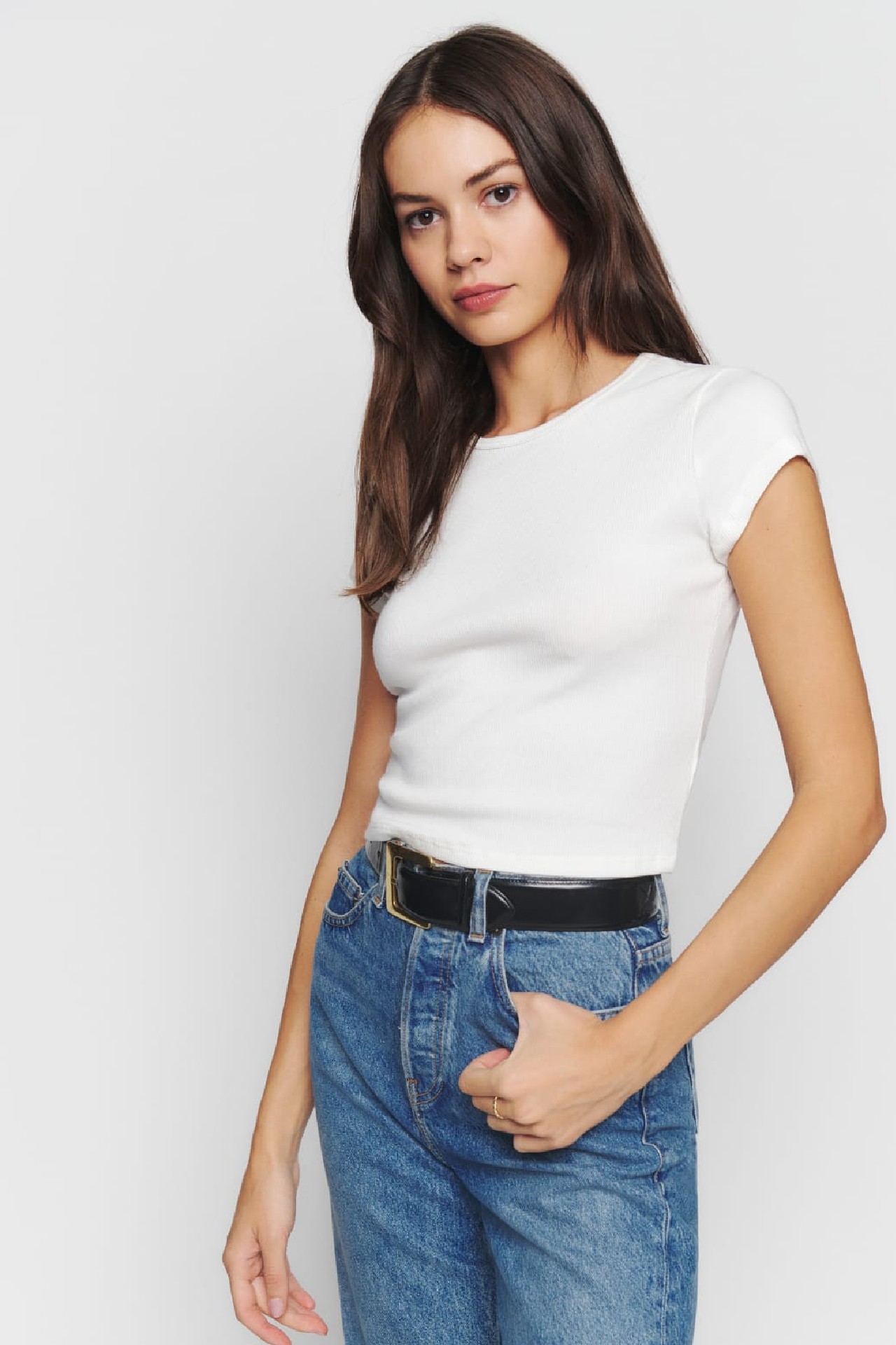 <h3><a href="https://www.thereformation.com/" target="_blank" rel="nofollow noopener">Reformation</a></h3><p>Reformation&rsquo;s tight-fitting Muse tee is made from a stretchy ribbed fabric comprised of 97 per cent organic cotton which crops at the waist. Featuring a crew neckline and capped sleeves, it serves as the perfect little T-shirt to style with your favourite pair of jeans.&nbsp;</p><p><strong>Material</strong>: 97 per cent organic cotton, spandex | <strong>Sizes</strong>: XS - XL | <strong>Cut</strong>: Round neck | <strong>Rating</strong>: N/A | <strong>Returns:</strong> 30-day policy | <strong>Shipping:</strong> Free express delivery</p><p><strong>SHOP NOW:</strong> Muse tee, $66 from<strong> <a href="https://www.thereformation.com/products/muse-tee/1307339IVO.html" target="_blank" rel="nofollow noopener">Reformation</a></strong></p><h2>How to style a white T-shirt</h2><p>The very best feature of the classic white T-shirt is its ability to be paired with almost anything. Whether you&rsquo;re after a weekend-worthy look, an office-appropriate ensemble or an outfit that is both chic yet comfortable for those days you find yourself working from home, the basic white T-shirt will transition seamlessly between each of these moods. Easily dressed up or down with the use of your favourite accessories, the multipurpose style can be paired with jeans and sneakers, skirts and sandals, and layered beneath dresses and blazers.</p><h2>How to clean a white T-shirt</h2><p>While the very best way to keep your white T-shirt looking pristine is to choose when you wear the style wisely, there are thankfully a handful of helpful tricks to washing your whites that you should take note of if you&rsquo;ve decided to wear the staple out to dinner at your favourite Italian restaurant. Gwen Whiting and Lindsey Boyd, the co-founders of The Laundress, shared with <a href="https://www.vogue.com/article/tricks-for-cleaning-summer-whites" target="_blank" rel="noopener">US <em>Vogue</em></a> that they always wash their whites in hot water. The pair also recommend pretreating your whites with with an enzyme-based remover before every wash, and prewashing with vinegar in order to remove odours.</p><p>If you have any unfortunate pit stains, Whiting and Boyd share the key to removing them is to work a stain solution into the troublesome area with a brush, before pouring hot water over the item from a height, and soaking it overnight. &ldquo;Repeat the process until the stain is lifted (and it will be!),&rdquo; The Laundress co-founders add.</p>