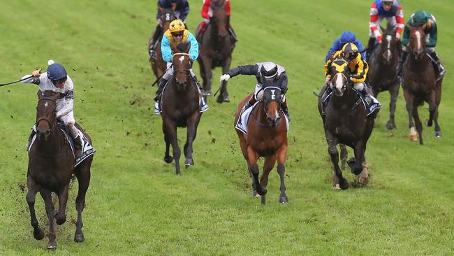 Ben Melham celebrates after riding She Will Reign to victory in the Goolden Slipper.