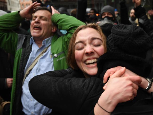 Assange supporters celebrate outside the court in London on Monday. Picture: AFP