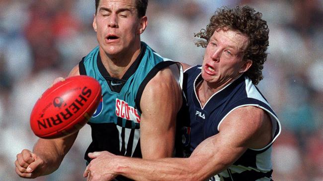 Geelong’s Garry Hocking tackles Port Adelaide’s Warren Tredrea in 1999. Picture: Ray Titus