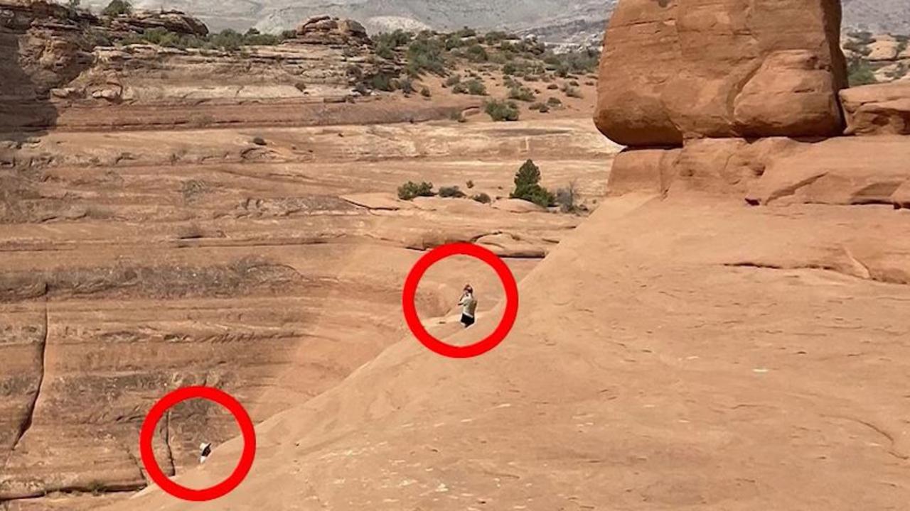 Laundrie (circled, left) and Petito (right) were friendly and appeared in a relaxed mood at the Delicate Arch landmark in Utah. Picture: Backgrid