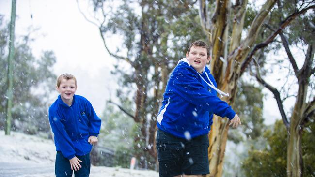 Archie and Riley Direen playing in the snow in Berriedale where roads became impassable on Tuesday afternoon. Picture: Richard Jupe