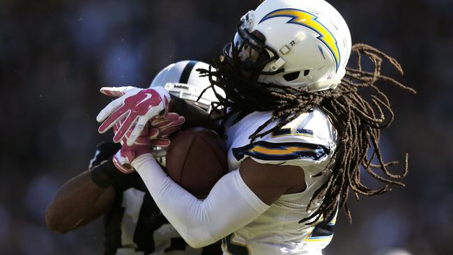 Jason Verrett wrestles the ball away from Brice Butler.